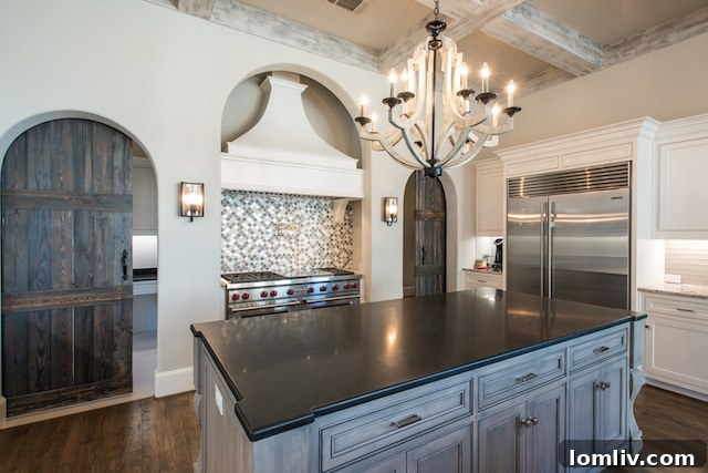 Spacious gourmet kitchen with an oversized island, top-tier appliances, and custom cabinetry, designed for culinary excellence at 6923 Ranier estate