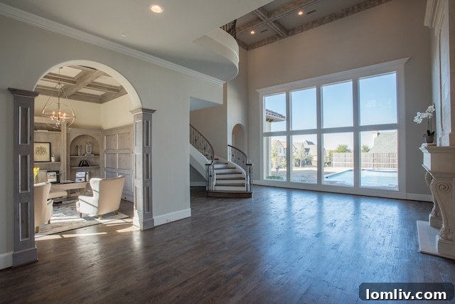 Another perspective of the elegant living room, highlighting the custom finishes, soaring ceilings, and exquisite design elements throughout 6923 Ranier