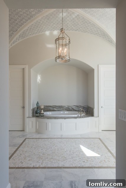 Luxurious primary bedroom showcasing a spacious layout, refined design, and abundant natural light, creating a serene retreat within 6923 Ranier