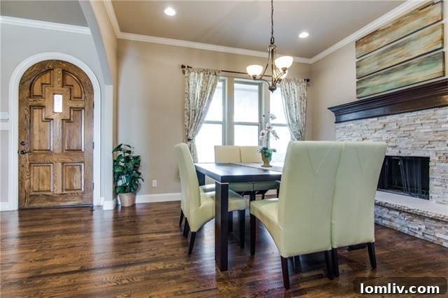 Inviting entryway with high ceilings and arched doorways