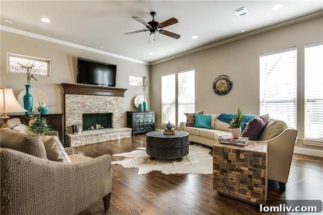Spacious living area with stone fireplace and open layout