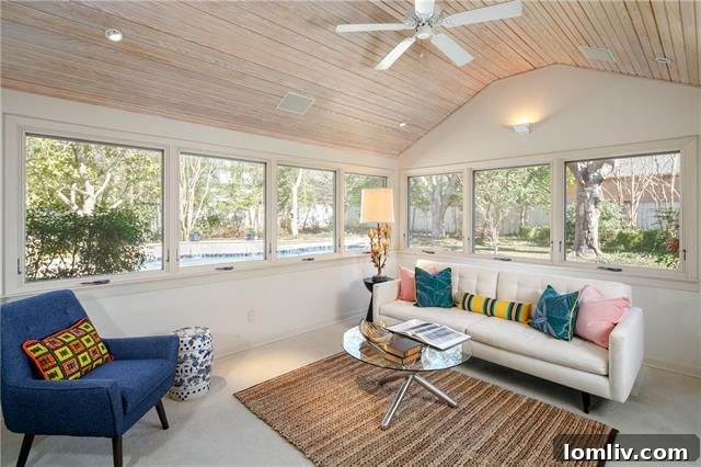 Spacious bedroom with vaulted ceiling and natural light