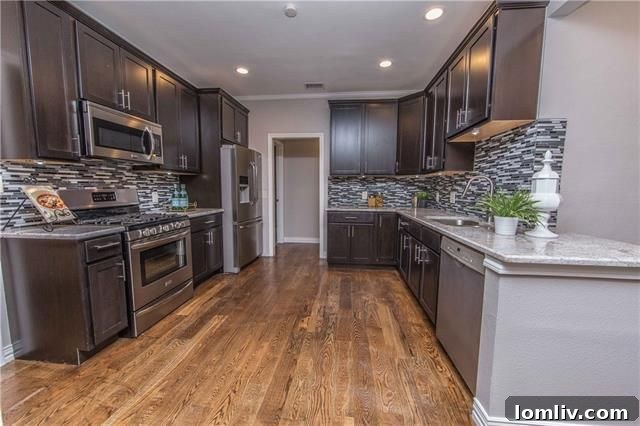 Gourmet kitchen with granite counters and custom cabinetry