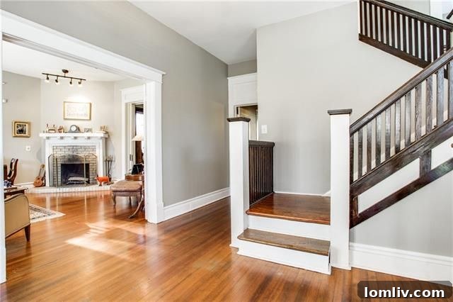 Inviting living room with fireplace in Munger Place Craftsman