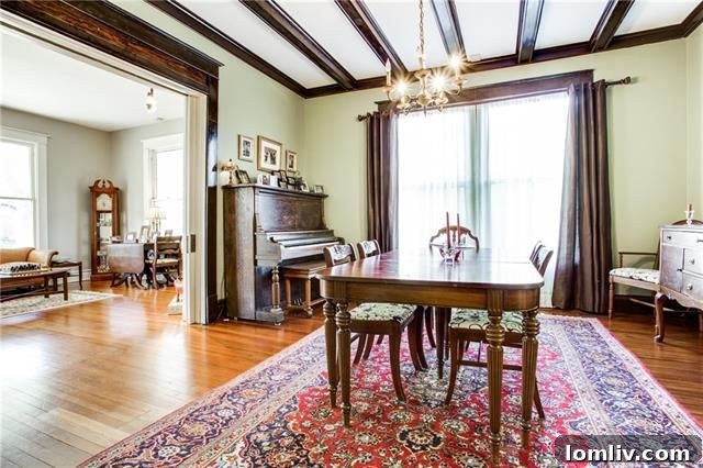 Elegant formal dining room with wood ceiling beams