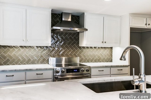 Modern open-concept kitchen with white cabinetry, new appliances, and waterfall island