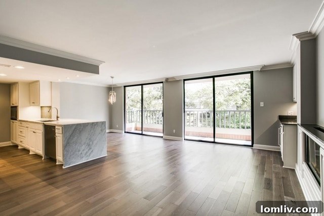 Bright and open living area with modern fireplace, bar, and large windows