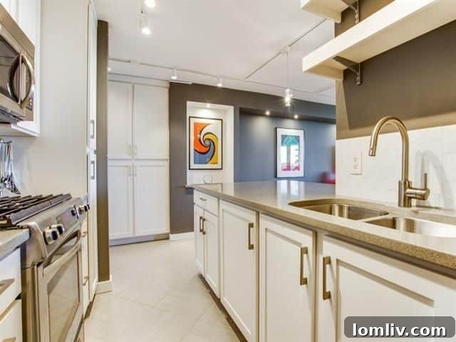 Modern Kitchen with Stainless Steel Appliances in Apt 904