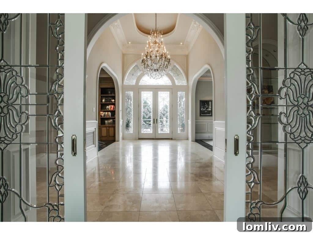 Grand entrance of a luxury Dallas home with leaded glass door
