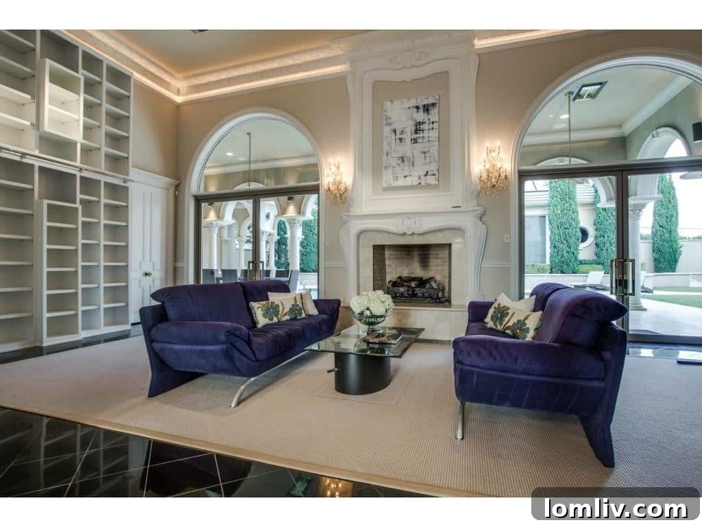 Luxurious formal living room with elegant furnishings and fireplace