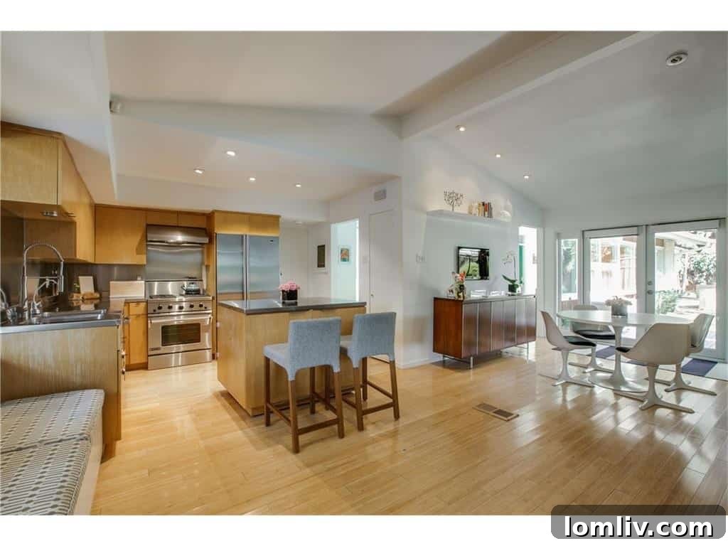 Danish Modern Kitchen with Blond Wood Cabinetry and Brushed Aluminum Finishes