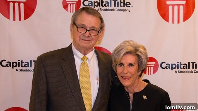 Group of smiling real estate professionals at the Capital Title party
