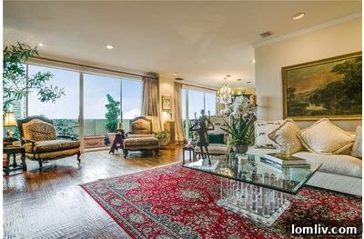 Spacious Living Room in Goldcrest Condo with Wall of Windows