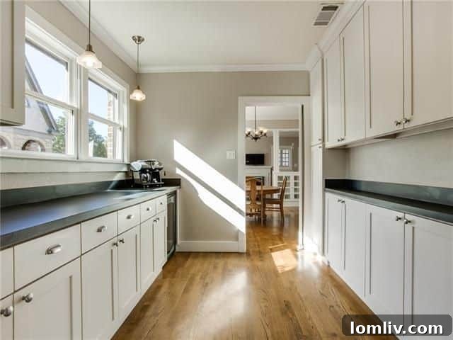 Modern bathroom with elegant fixtures and finishes in renovated Tudor at 834 Salmon Drive