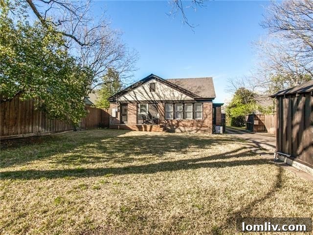 Found: Your North Oak Cliff Tudor Dream Home 24 Final exterior view highlighting the grand presence of the renovated Tudor revival home