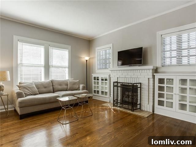 Open concept living and dining rooms with custom divider cabinets at 834 Salmon Drive