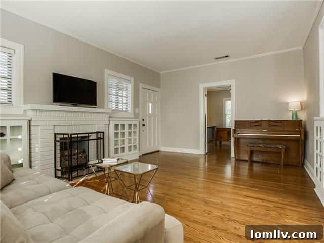 Elegant dining room with original hardwood floors in Kessler Park Tudor