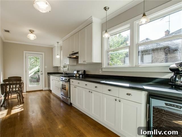 Another view of a bedroom showcasing ample natural light in Kessler Park home