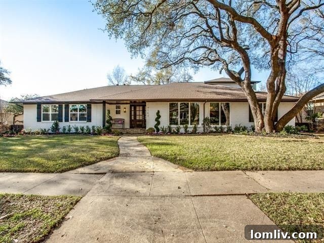 Sleek exterior of the beautifully renovated ranch home at 7142 Mimosa Ln in The Meadows.