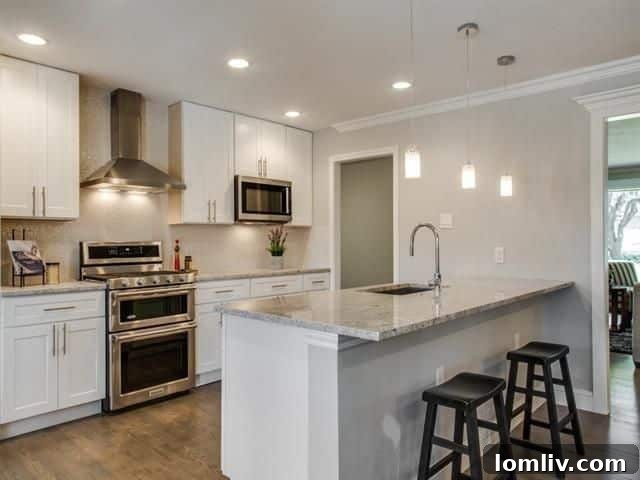 Stunning newly remodeled kitchen with stainless steel appliances and an imported Spanish backsplash.