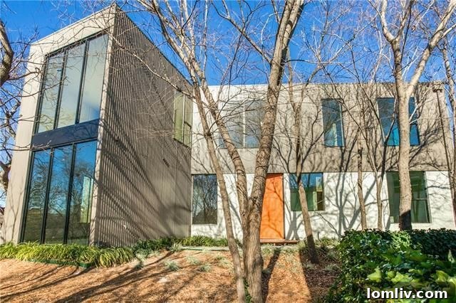 Exterior view of the modern home at 47 Vanguard Way, blending seamlessly with its natural surroundings.