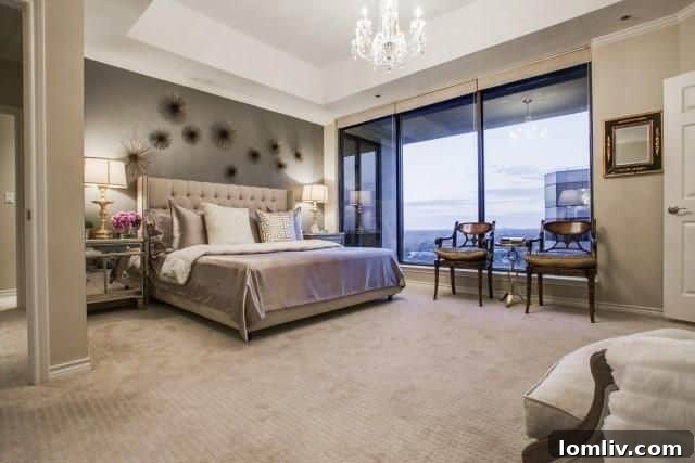 The opulent master suite, featuring a comfortable sitting area and designer touches.