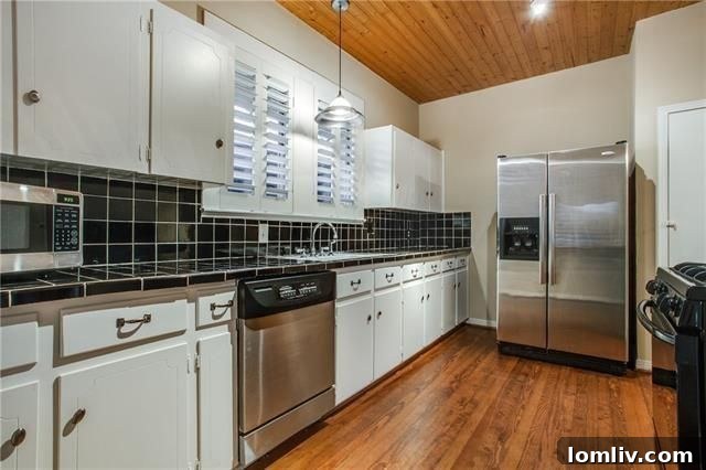 Bright interior space showcasing hardwood floors and brick accent walls.