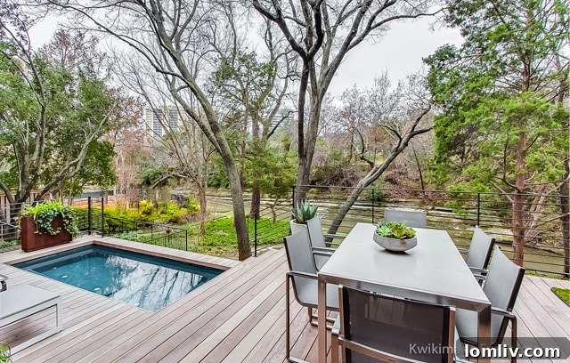 Single-family home on Turtle Creek Bend, adorned with art and offering stunning views of Turtle Creek.