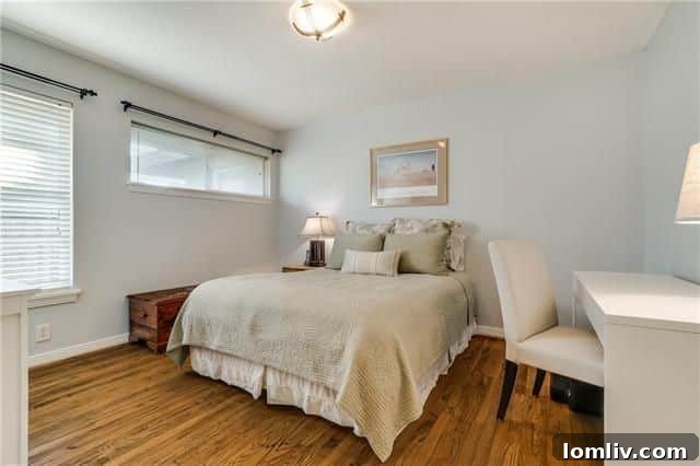 Another view of a comfortable bedroom, highlighting its generous size and inviting atmosphere.
