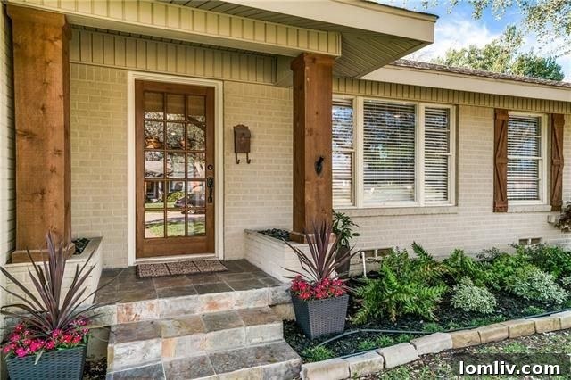 The two-car garage of the Alger Park home, featuring stylish new wood garage doors that complement the home's updated exterior.