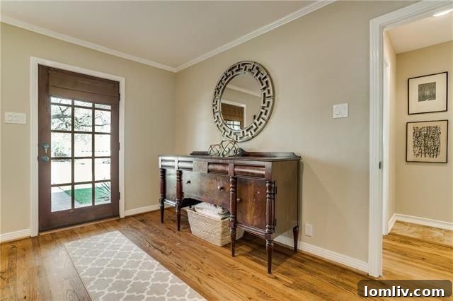 Spacious backyard of 9715 Cloister Dr with a covered patio, perfect for outdoor living and entertaining in Alger Park.