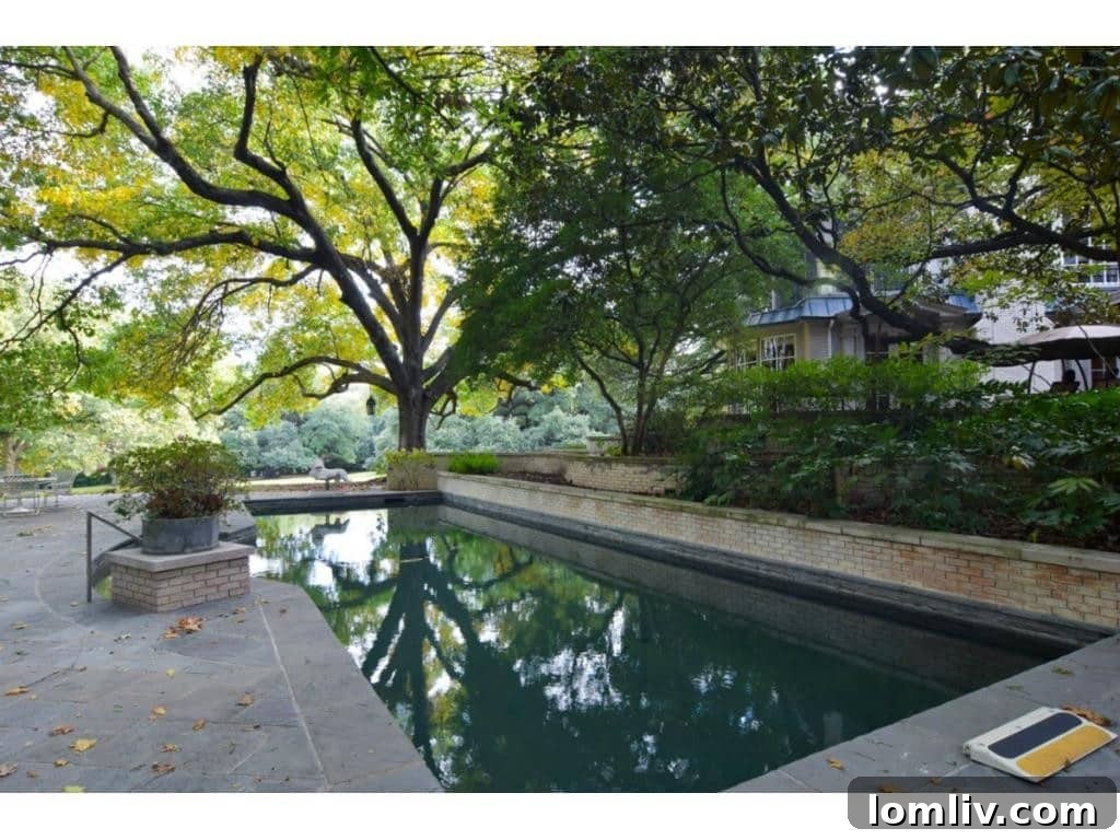 Dallas's Richest Real Estate: Did Andy Beal Acquire the Two Most Expensive Mansions? 24 The sparkling pool area of the Margaret Crow Estate, offering a luxurious retreat at 4500 Preston Road.