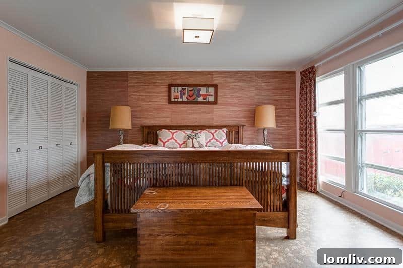 Master bedroom in Mamie Eisenhower pink with grasscloth accents