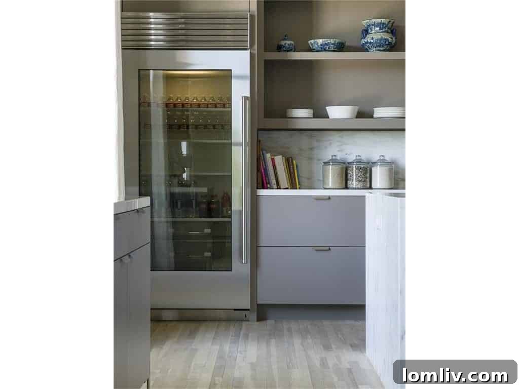 Entry level with elegant staircase and access to garage