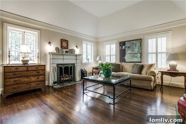 Modern updated kitchen with white cabinets, granite, and stainless steel appliances