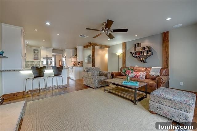 Inviting living area with exposed wood beams and hardwood floors