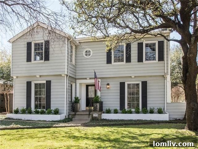 Elegant Greenway Park Traditional home exterior with manicured landscaping