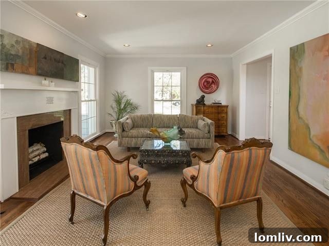 Gracious formal living room with wood-burning fireplace and floor-to-ceiling windows