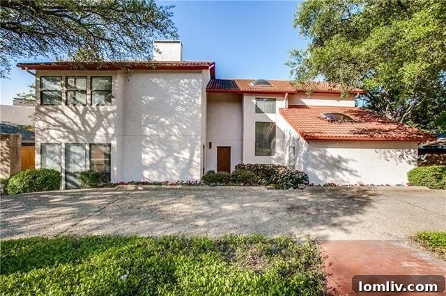 Expansive contemporary home exterior with mature trees in Lake Highlands