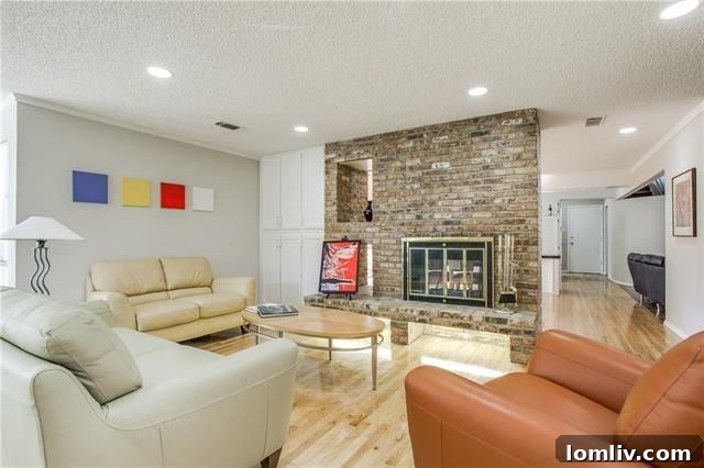 Secluded backyard pool area with lush landscaping, ideal for entertaining