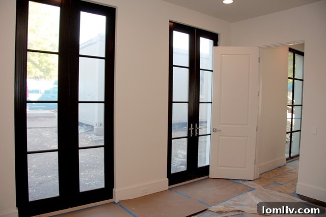 Second bedroom with French doors in The Mondara luxury condos