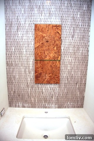 Dramatic sculptural tile in the half bath of The Mondara luxury residence