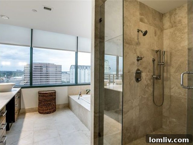 Bright and modern master bathroom with dual sinks and separate shower