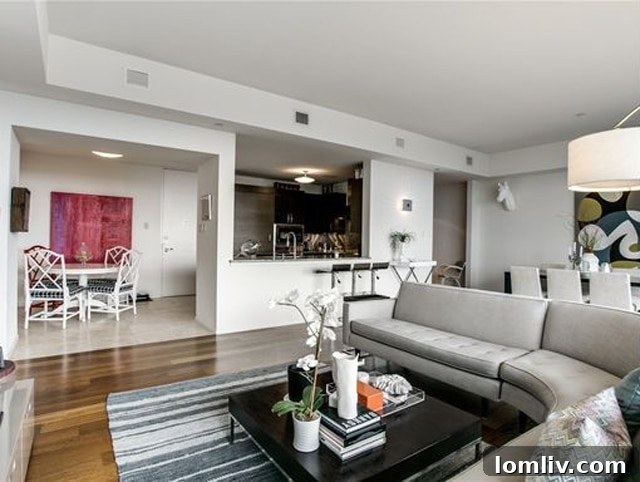 Spacious living room with high ceilings and city views in Unit 1208