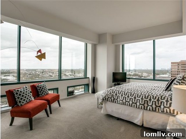 Spacious master bedroom filled with natural light and city views