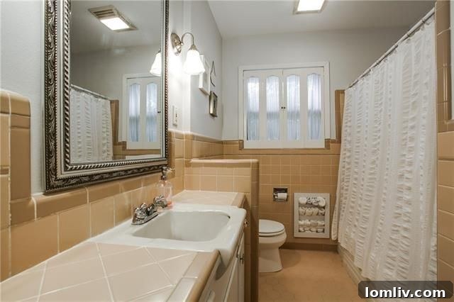 Original bathroom with charming pink-and-cream tiles