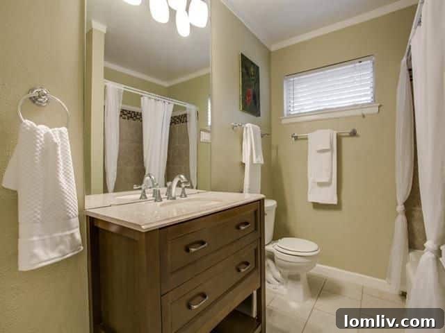 Updated bathroom with frameless glass shower