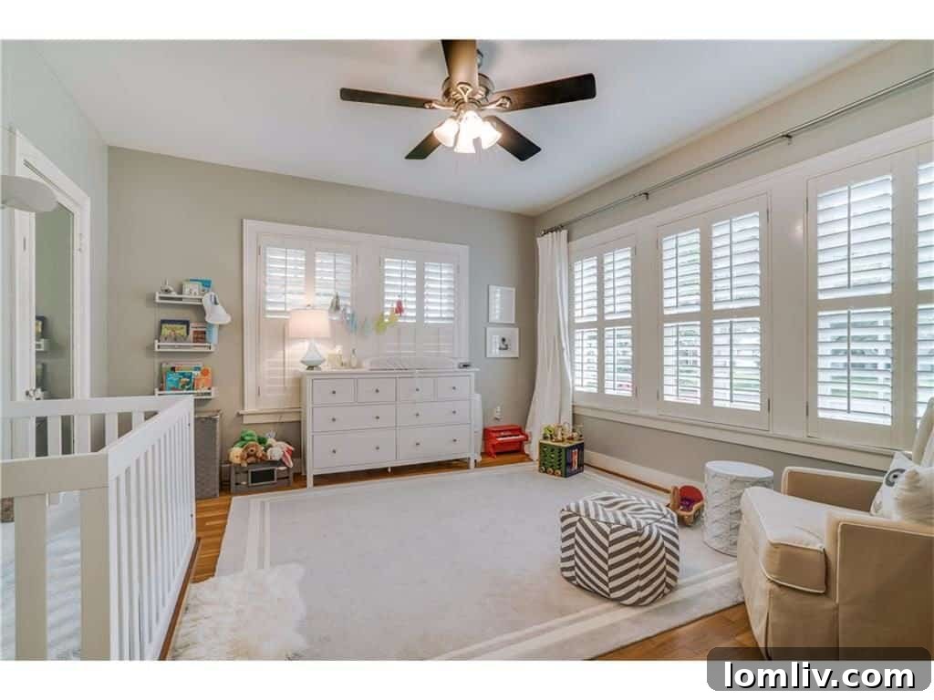 Bright Secondary Bedroom with Neutral Decor and Hardwood Floors