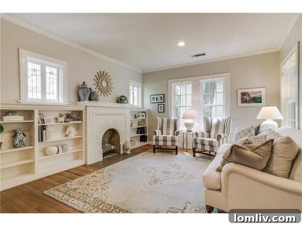 Bright and Inviting Living Room with Built-in Bookshelves in Dallas Tudor Home