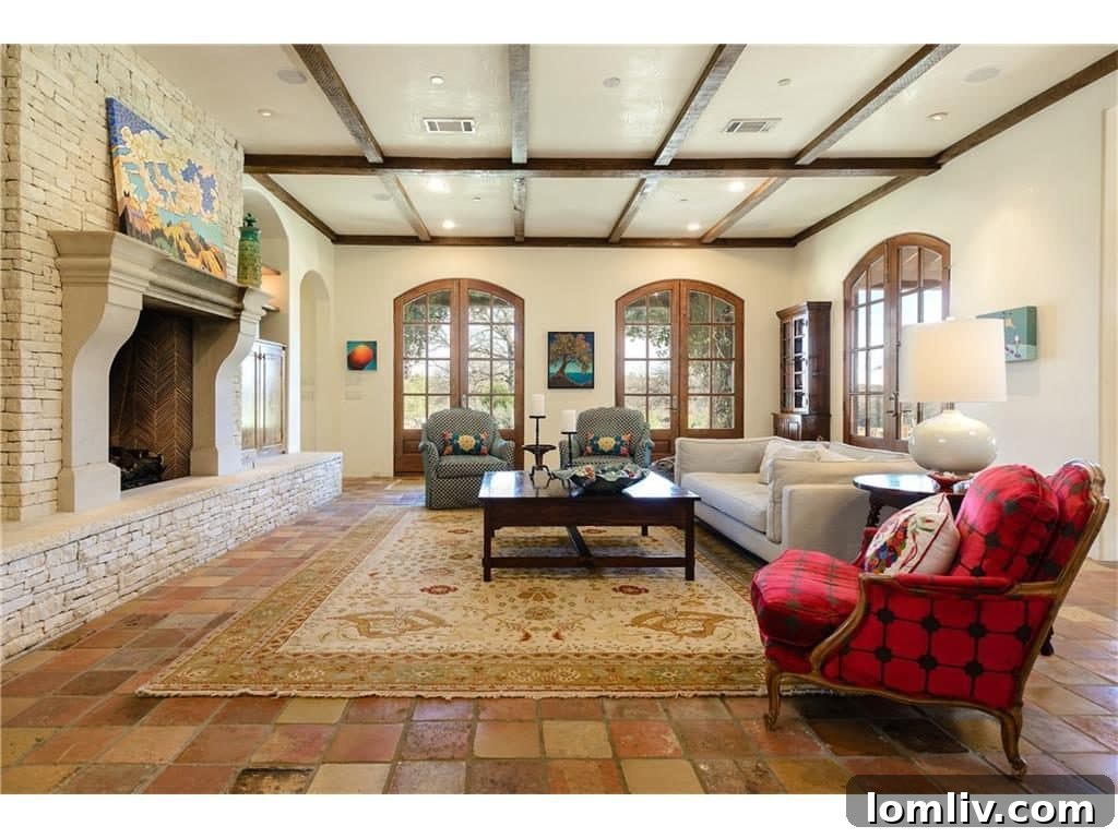 Inviting family room with fireplace and exposed beams, offering comfort and style